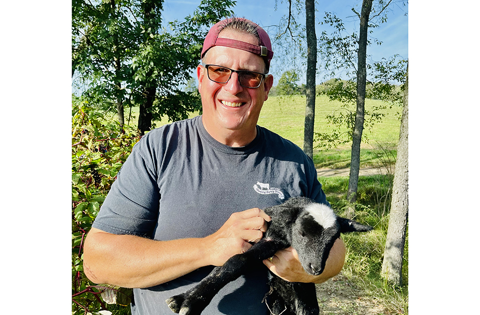Charles with baby goat