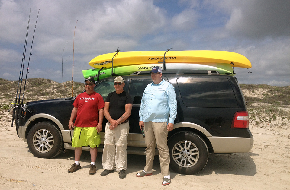 Charles with family and kayaks